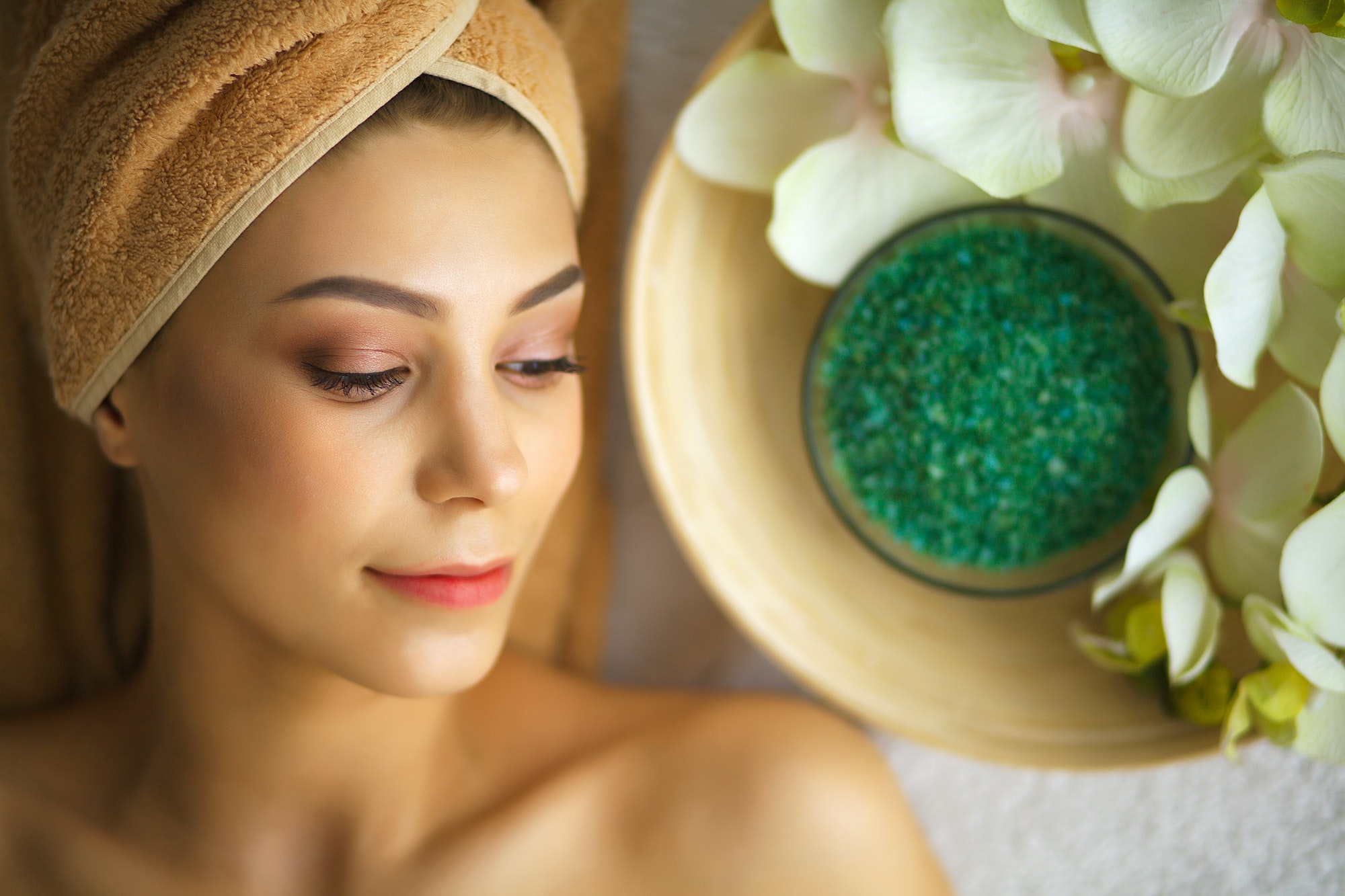 Spa. Young woman on massage table in beauty spa salon