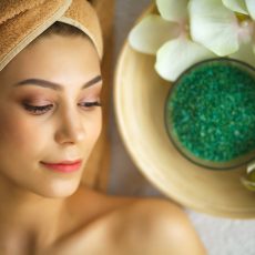 Spa. Young woman on massage table in beauty spa salon