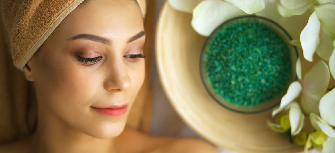 Spa. Young woman on massage table in beauty spa salon